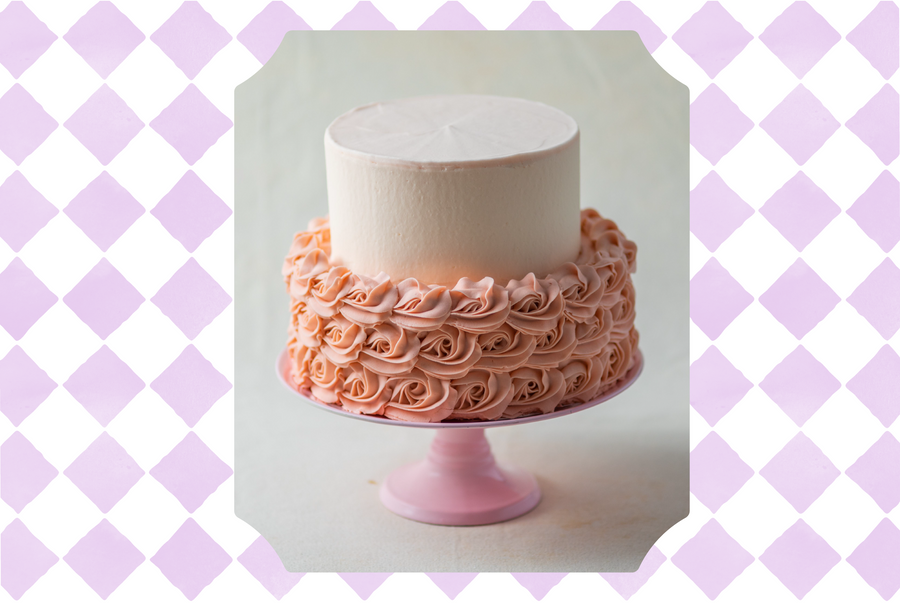 Cake on a stand with piping